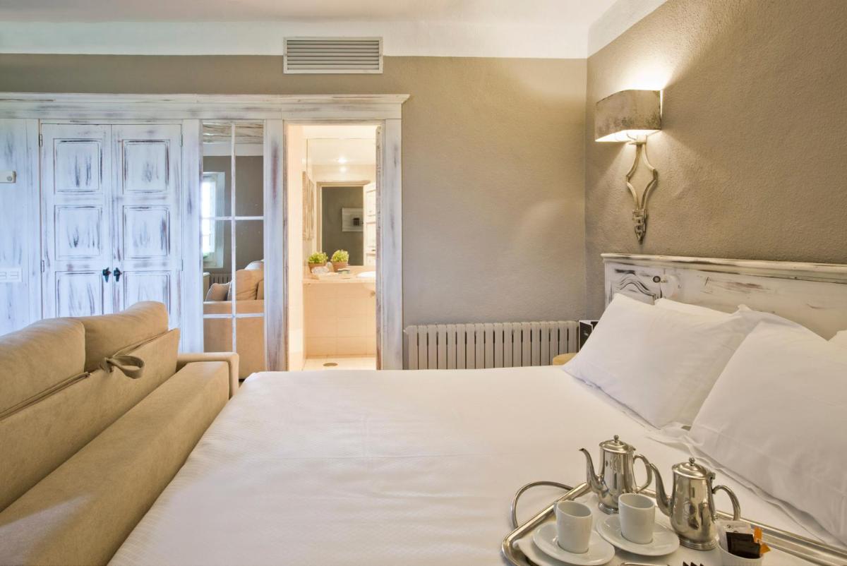 Cama o camas de una habitación en Hotel Luze El Toro