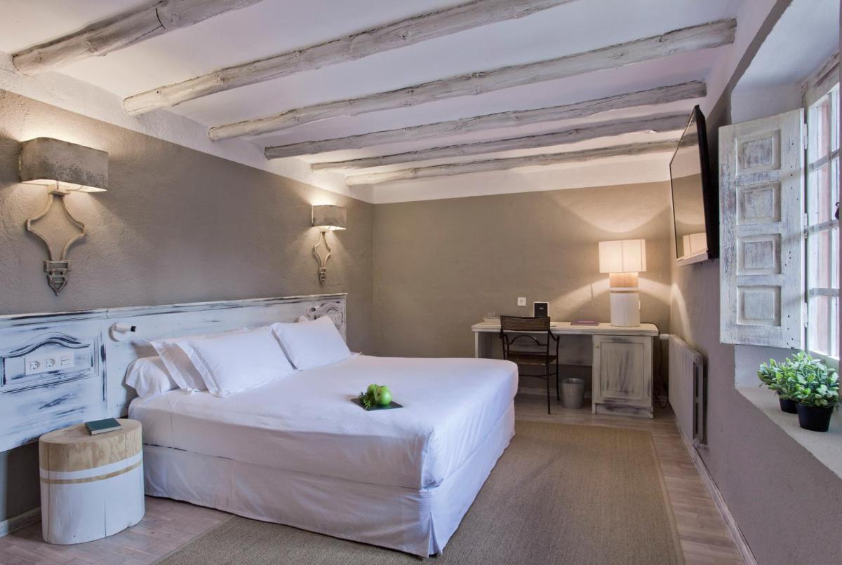 Cama o camas de una habitación en Hotel Luze El Toro