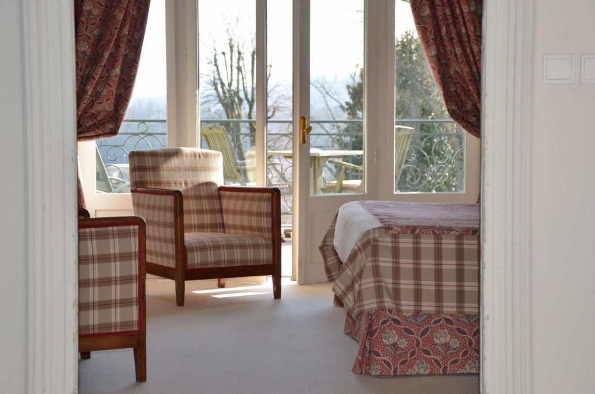 Un ou plusieurs lits dans un hébergement de l'établissement Hôtel Villa Navarre