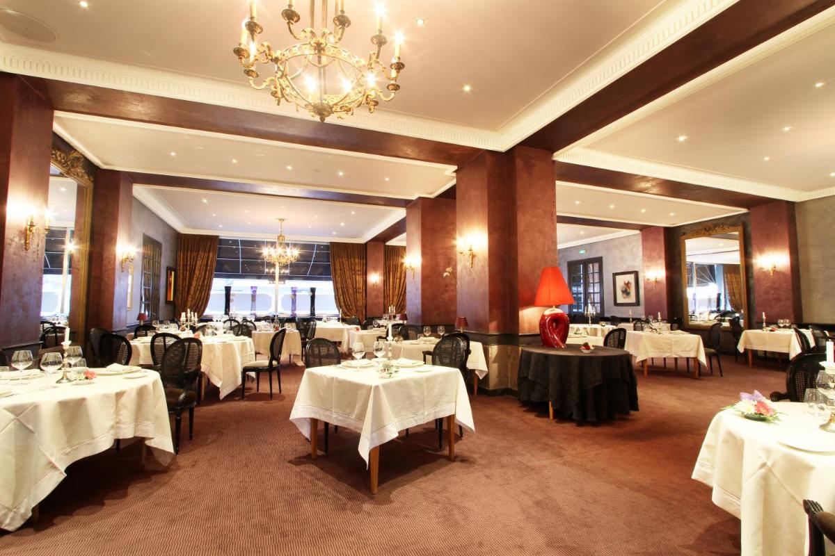 Restaurant ou autre lieu de restauration dans l'établissement Le Grand Hotel & Spa