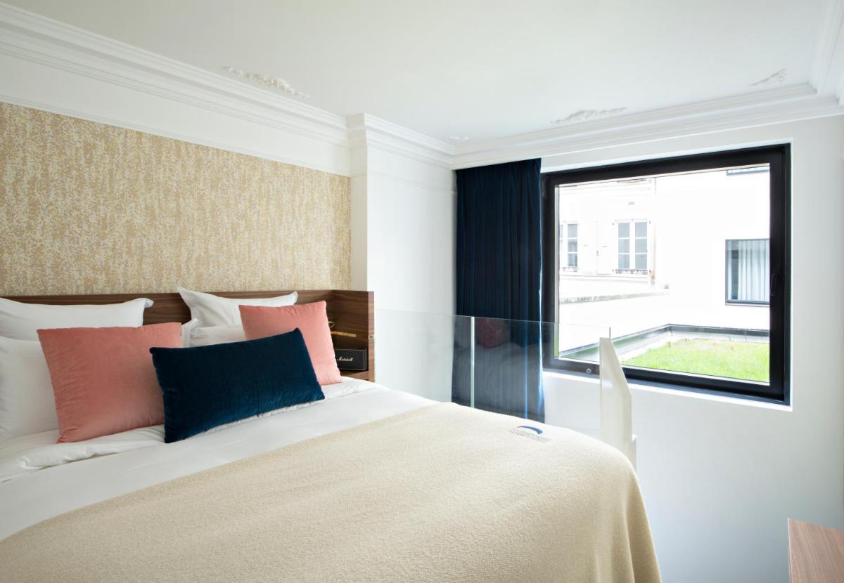 Un ou plusieurs lits dans un hébergement de l'établissement Hotel Parister Piscine & Spa