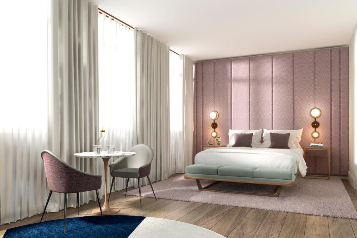 Un ou plusieurs lits dans un hébergement de l'établissement Maison Bréguet