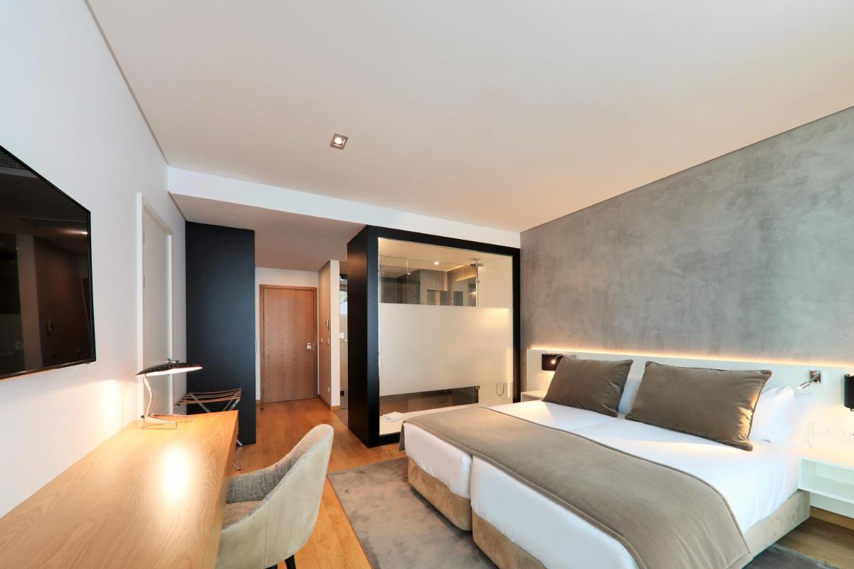 Uma cama ou camas num quarto em Iberostar Selection Lisboa