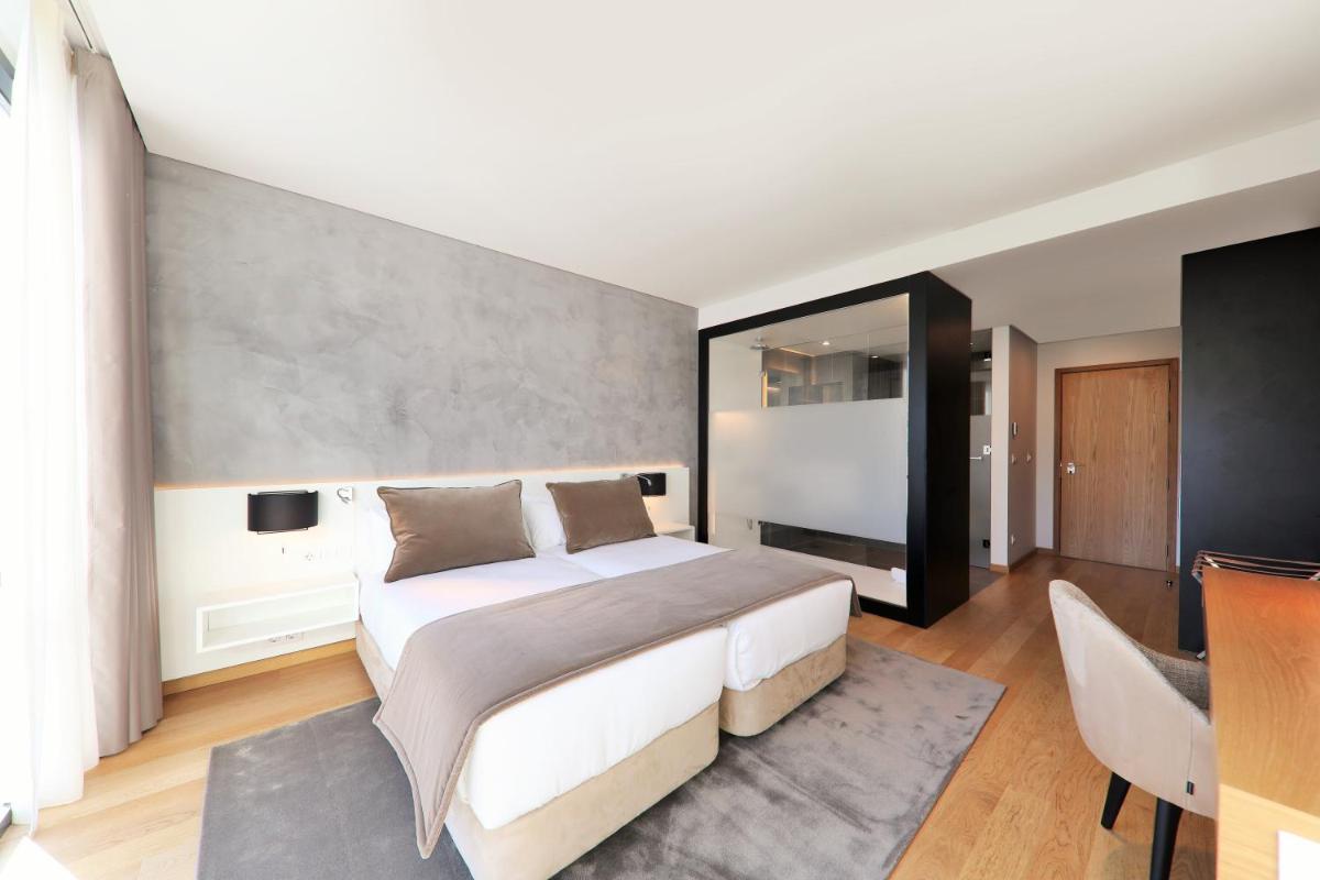 Uma cama ou camas num quarto em Iberostar Selection Lisboa