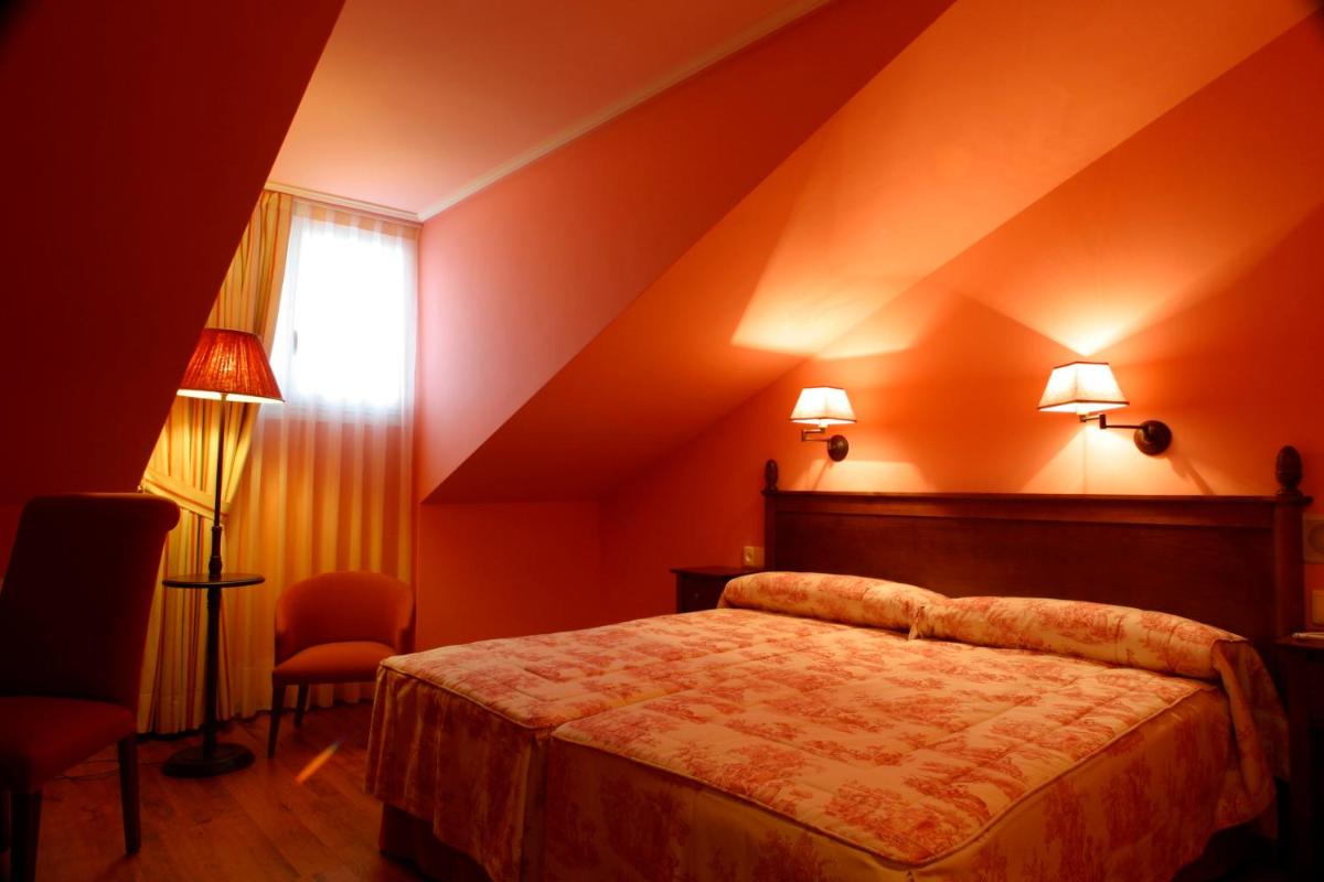 Cama o camas de una habitación en Silken Spa La Hacienda De Don Juan