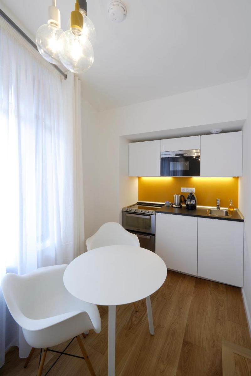 Cuisine ou kitchenette dans l'établissement Les Maisons du Pont - Charme & Caractère