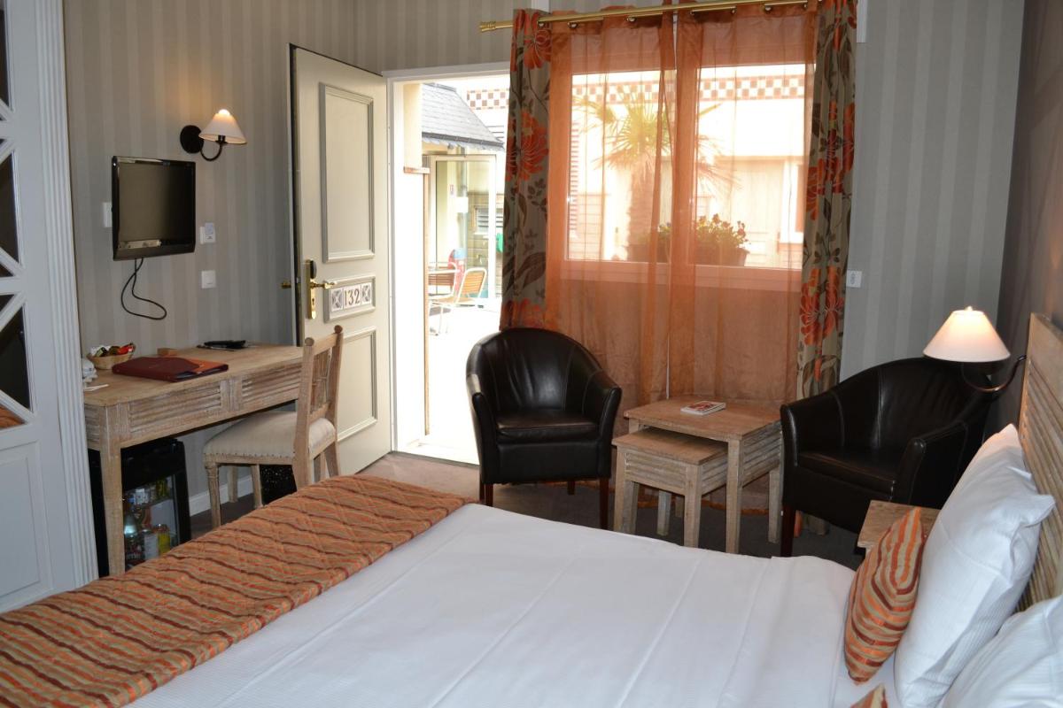 Un ou plusieurs lits dans un hébergement de l'établissement Almoria Hôtel & SPA