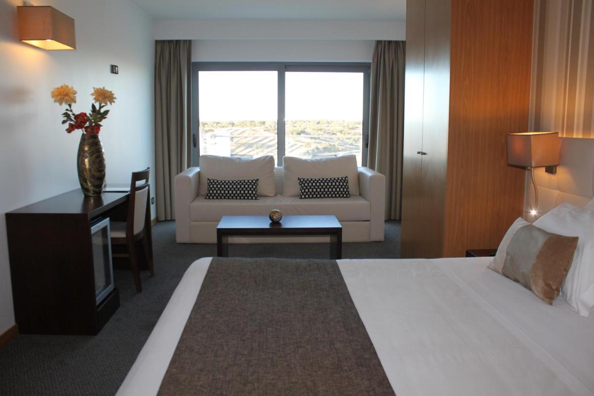 Uma cama ou camas num quarto em Hotel O Gato & Spa