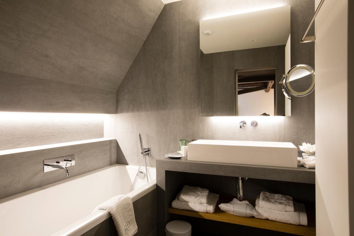 Salle de bains dans l'établissement Relais & Châteaux La Maison Des Têtes