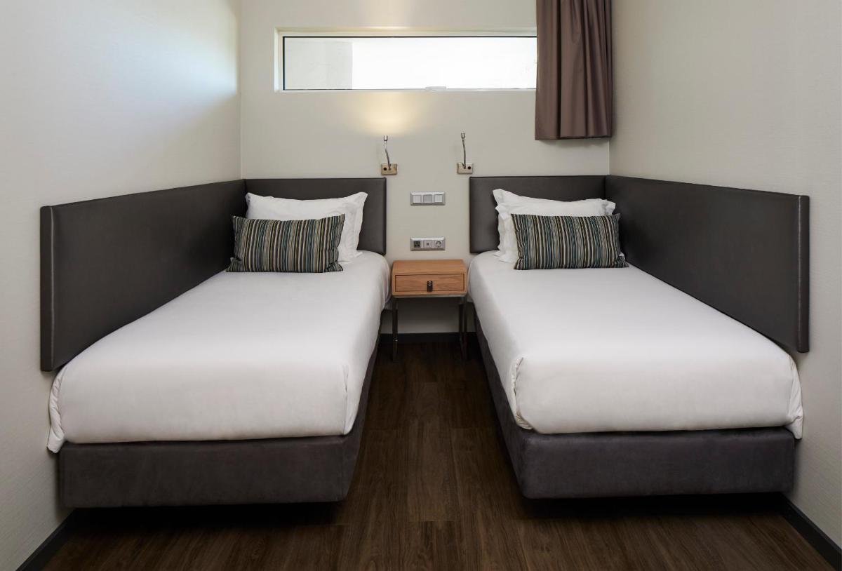 Uma cama ou camas num quarto em Alcazar Hotel & SPA
