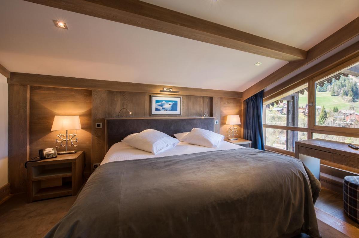 Un ou plusieurs lits dans un hébergement de l'établissement Hotel le Petit Dru
