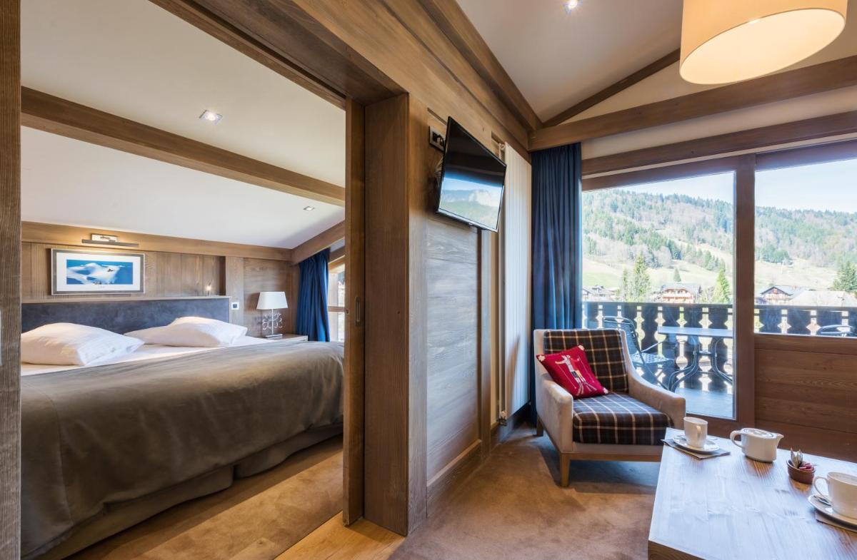 Un ou plusieurs lits dans un hébergement de l'établissement Hotel le Petit Dru