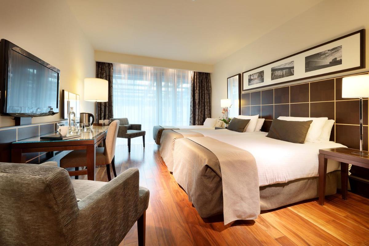 Ein Bett oder Betten in einem Zimmer der Unterkunft Eurostars Berlin