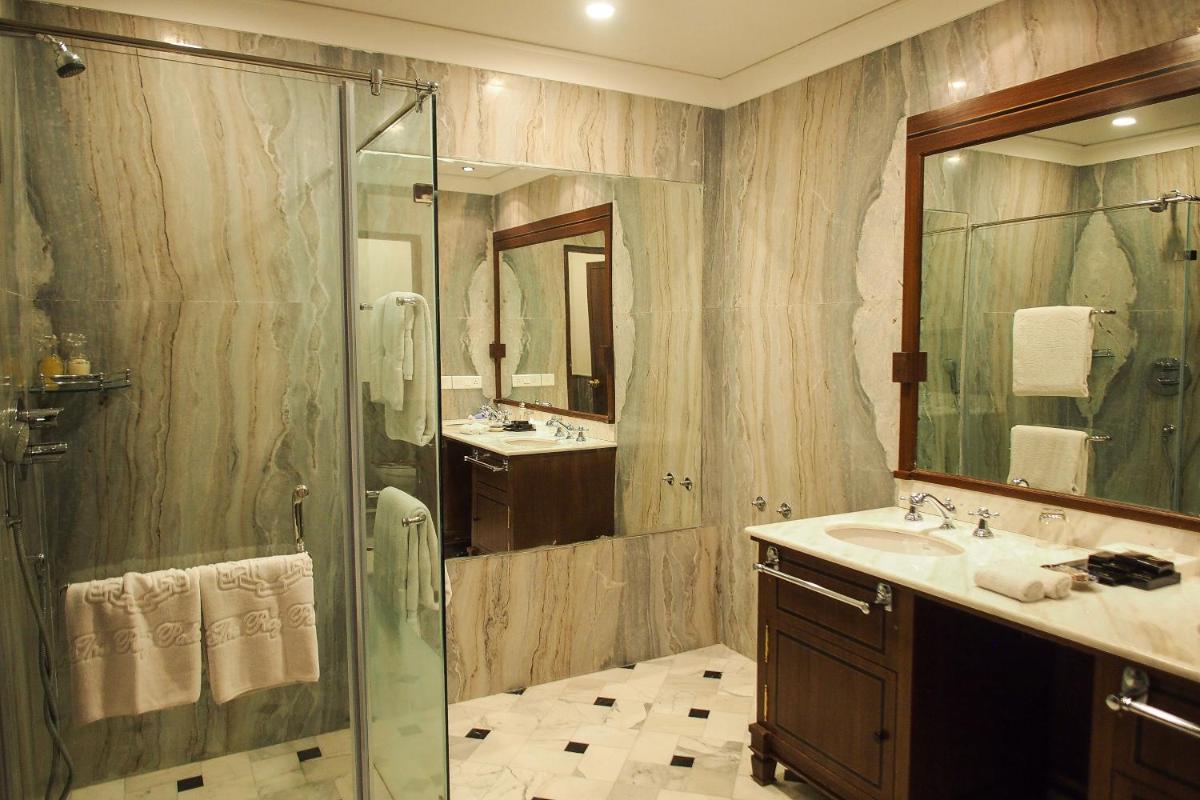 a bathroom with a shower and a sink at The Raj Palace (Small Luxury Hotels of the World) in Jaipur