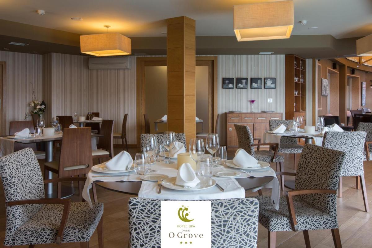 Un restaurante o sitio para comer en Hotel Spa Norat O Grove 3* Superior