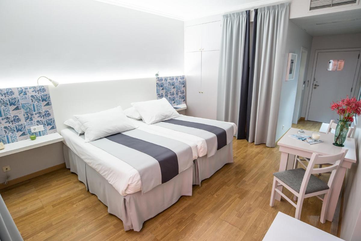 Uma cama ou camas num quarto em Sé Boutique Hotel