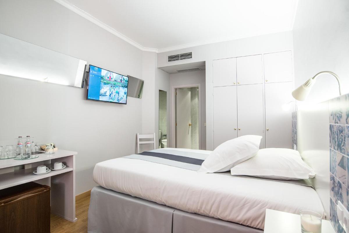 Uma cama ou camas num quarto em Sé Boutique Hotel