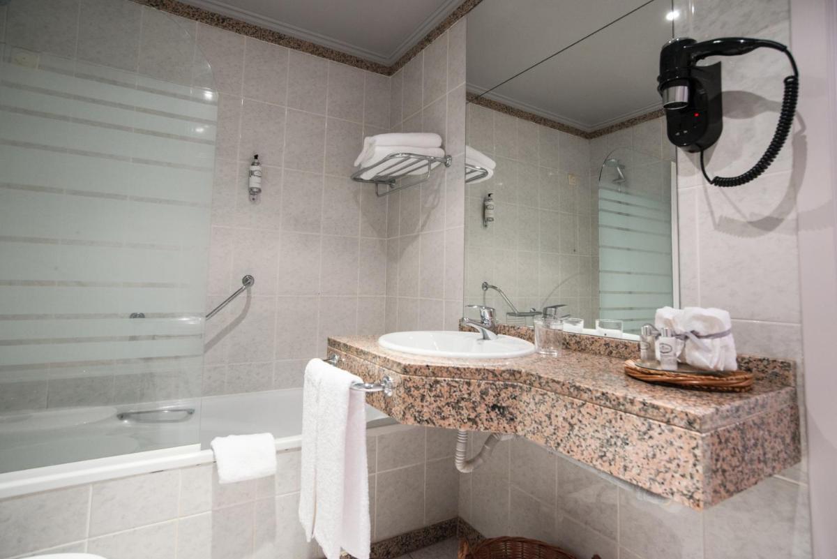 Uma casa de banho em Sé Boutique Hotel