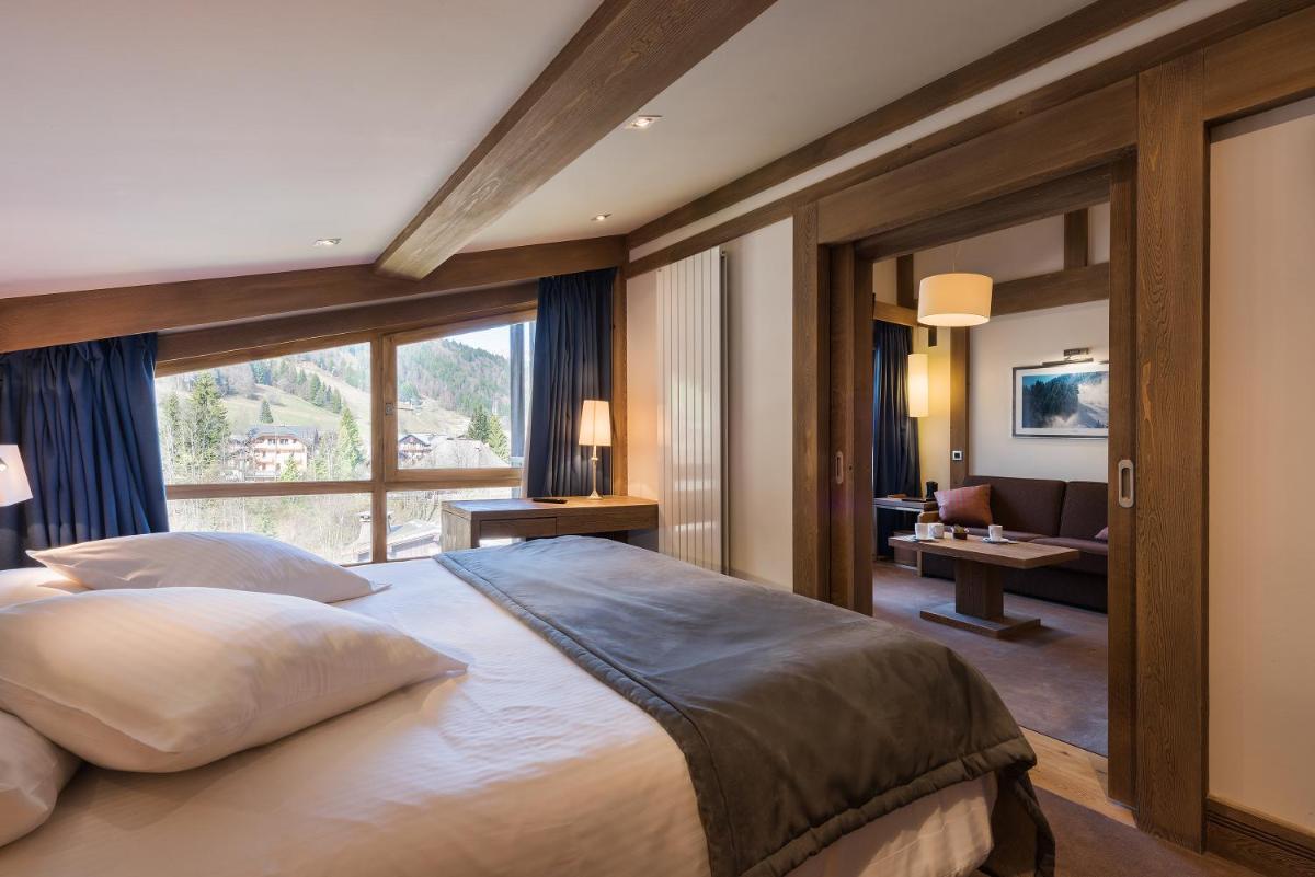Un ou plusieurs lits dans un hébergement de l'établissement Hotel le Petit Dru