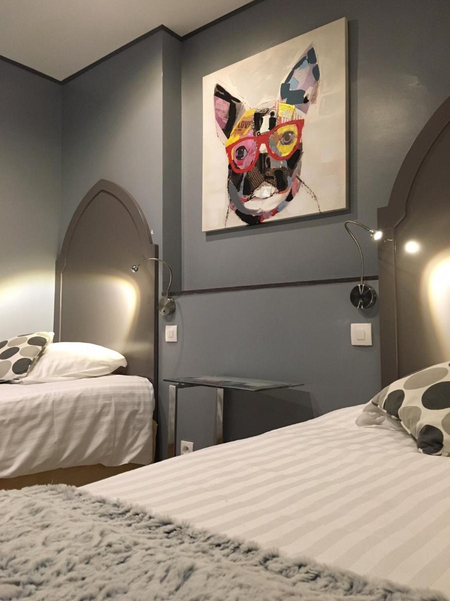 Un ou plusieurs lits dans un hébergement de l'établissement Les Terrasses de Saumur - Hôtel & Appartements - Restaurant & Spa (Logis)