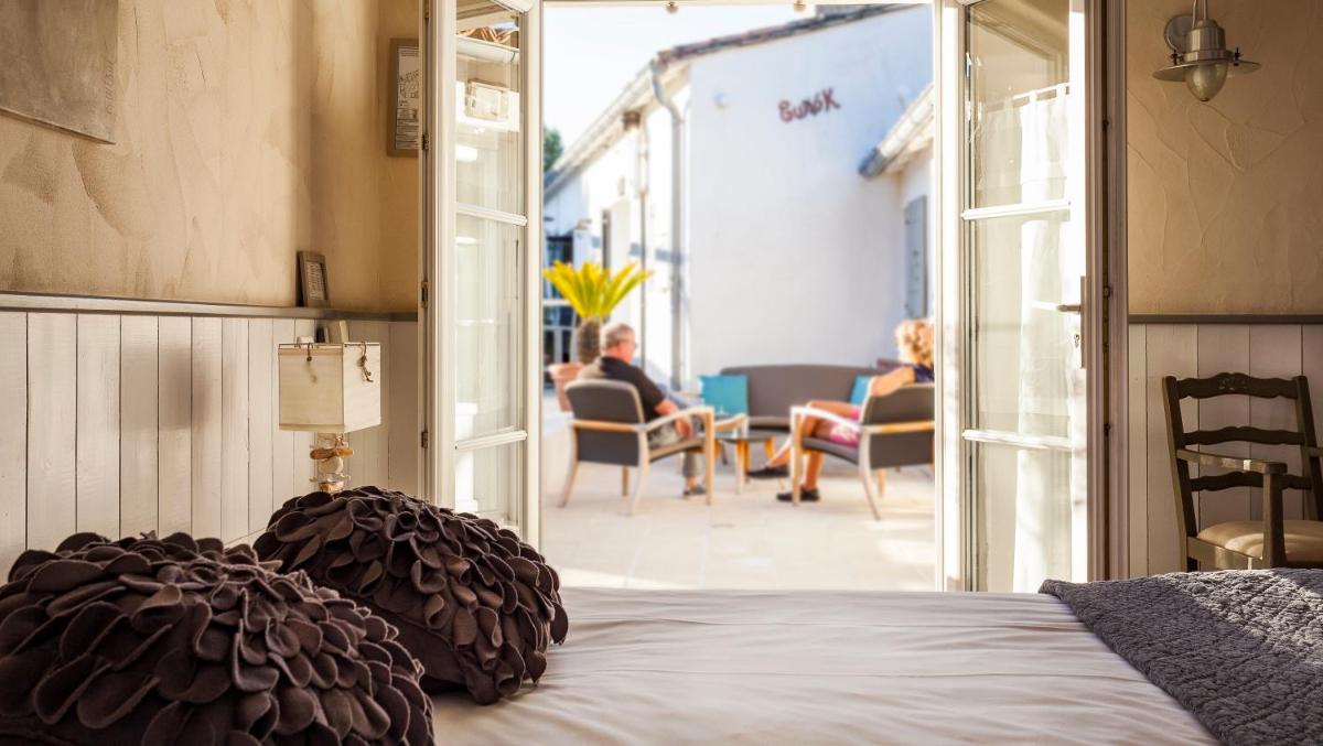 Un ou plusieurs lits dans un hébergement de l'établissement Hotel Les Bois Flottais