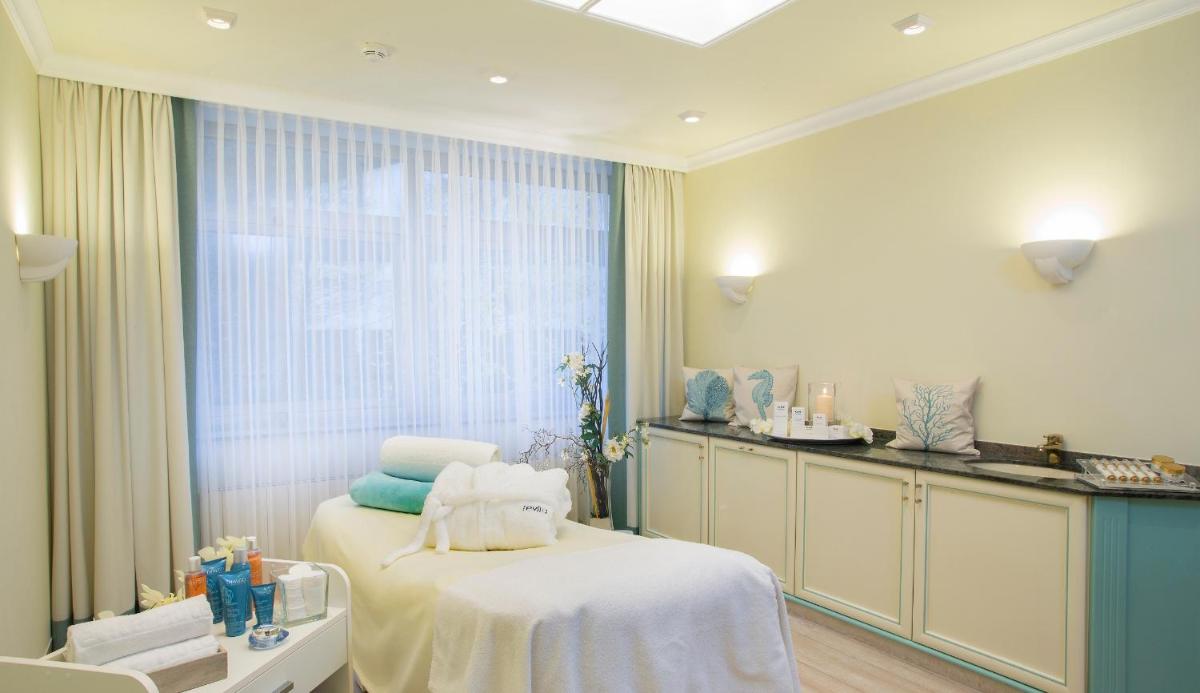 Ein Bett oder Betten in einem Zimmer der Unterkunft revita - naturresort & spa