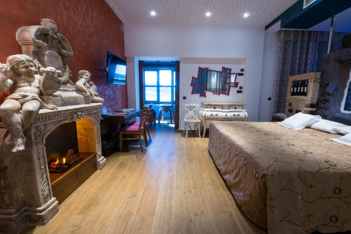 Cama o camas de una habitación en Hotel SPA El Lagar de Isilla