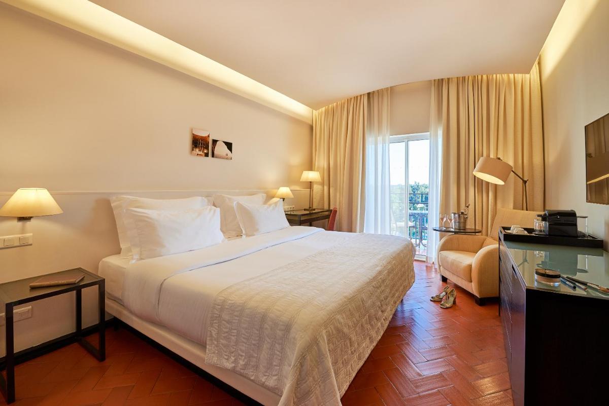 Uma cama ou camas num quarto em Penina Hotel & Golf Resort