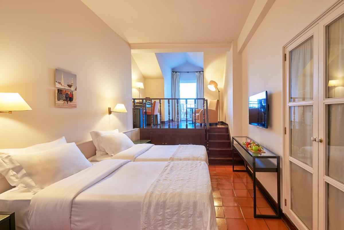 Uma cama ou camas num quarto em Penina Hotel & Golf Resort