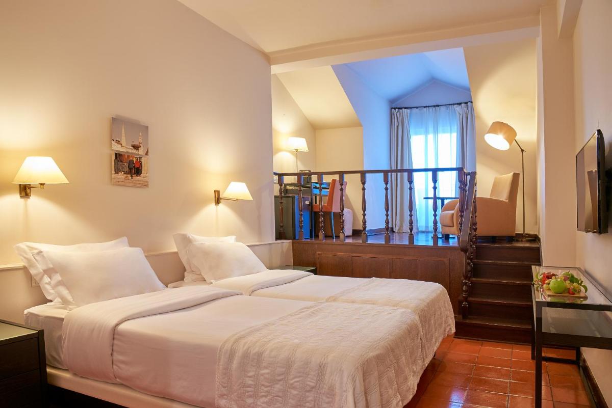 Uma cama ou camas num quarto em Penina Hotel & Golf Resort
