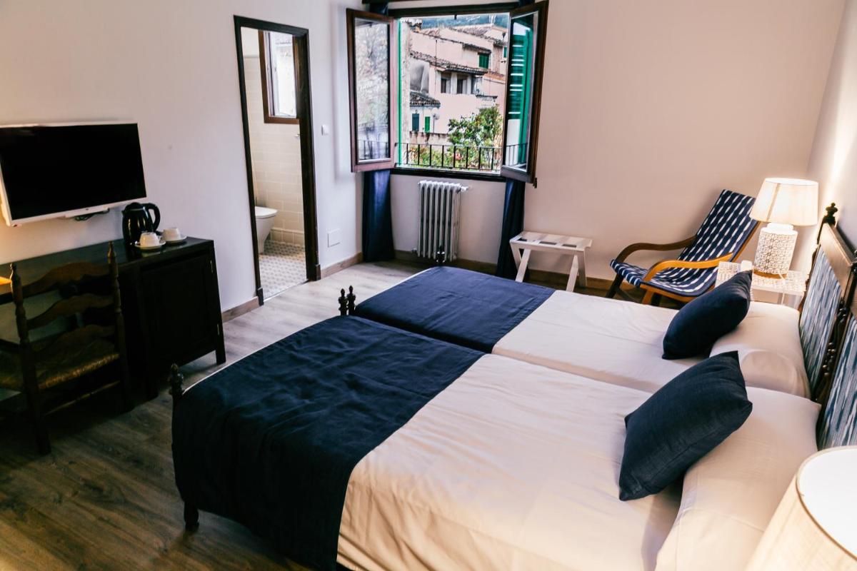 Cama o camas de una habitación en Hotel El Guía