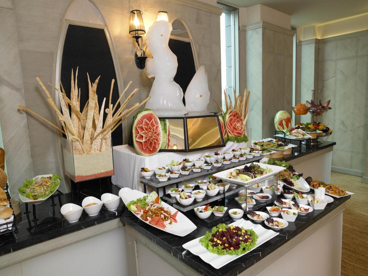 a buffet with a lot of food on a table at The Zuri Whitefield Bengaluru in Bengaluru