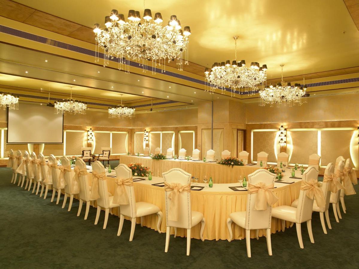 a conference room with a long table and chairs at The Zuri Whitefield Bengaluru in Bengaluru +36 photos