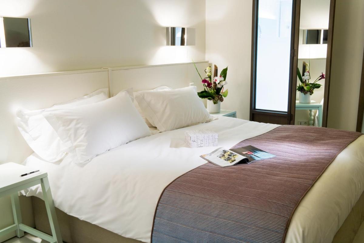 Un ou plusieurs lits dans un hébergement de l'établissement Pullman Cannes Mandelieu