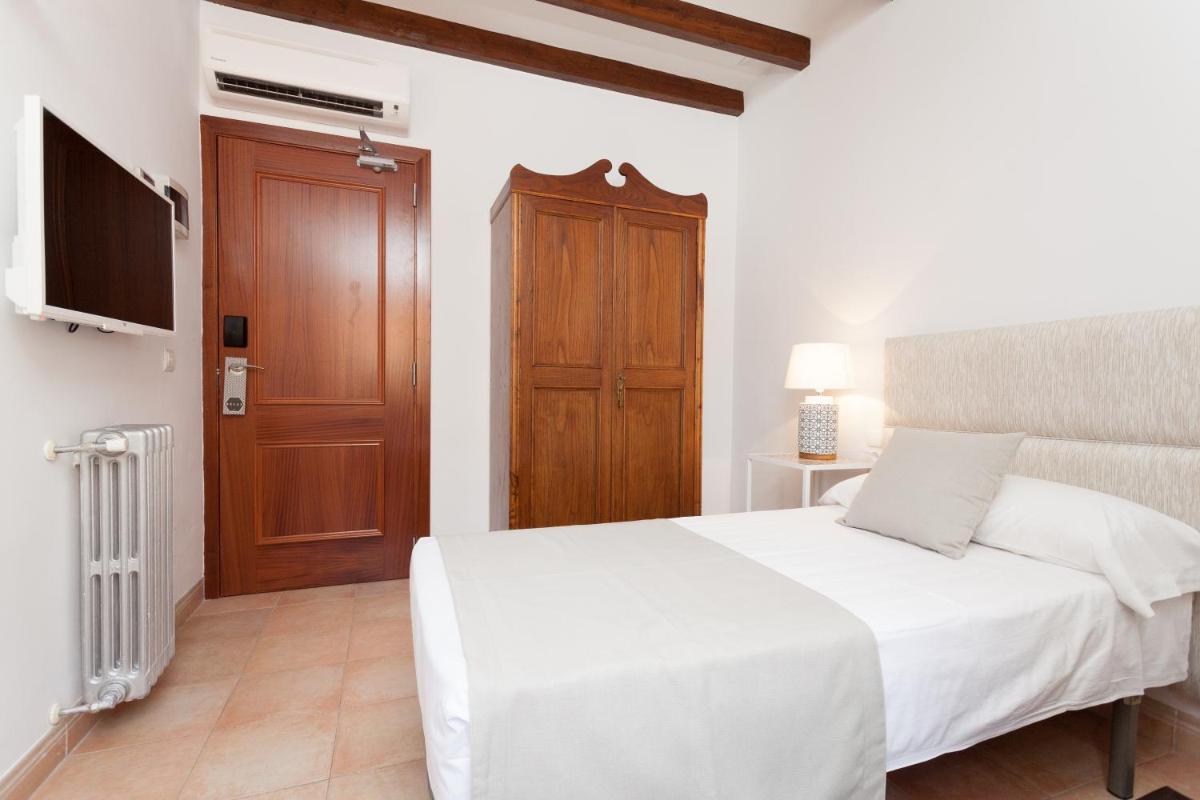 Cama o camas de una habitación en Hotel El Guía