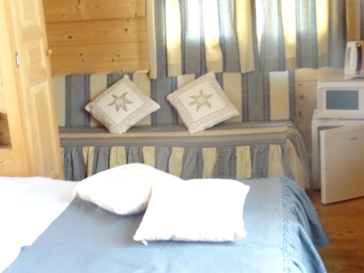 Un ou plusieurs lits dans un hébergement de l'établissement Apart'hotel & Spa "La Destière"
