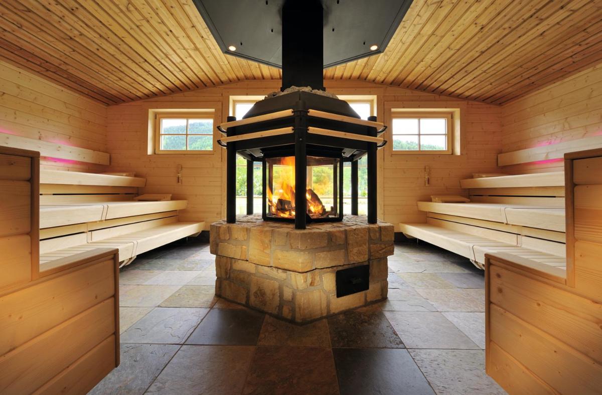 Ein Bett oder Betten in einem Zimmer der Unterkunft Wellness & Genuss Resort - Engel Obertal