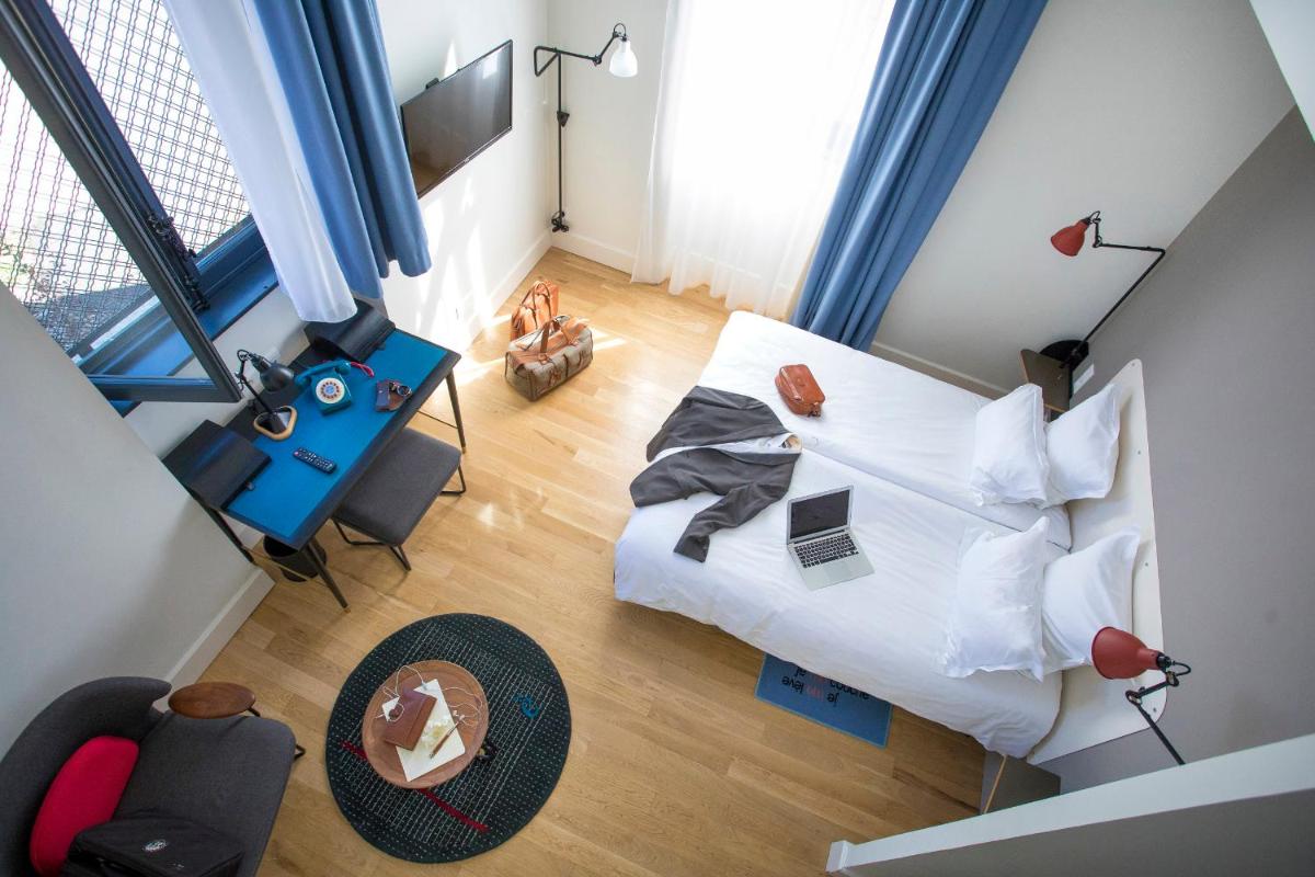 Un ou plusieurs lits dans un hébergement de l'établissement Fourvière Hôtel
