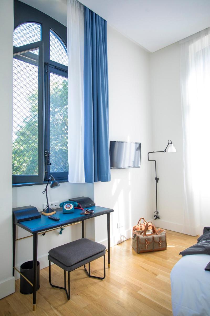 Un ou plusieurs lits dans un hébergement de l'établissement Fourvière Hôtel