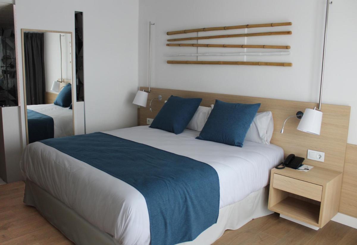 Cama o camas de una habitación en AQUA Hotel Onabrava & Spa 4*Sup