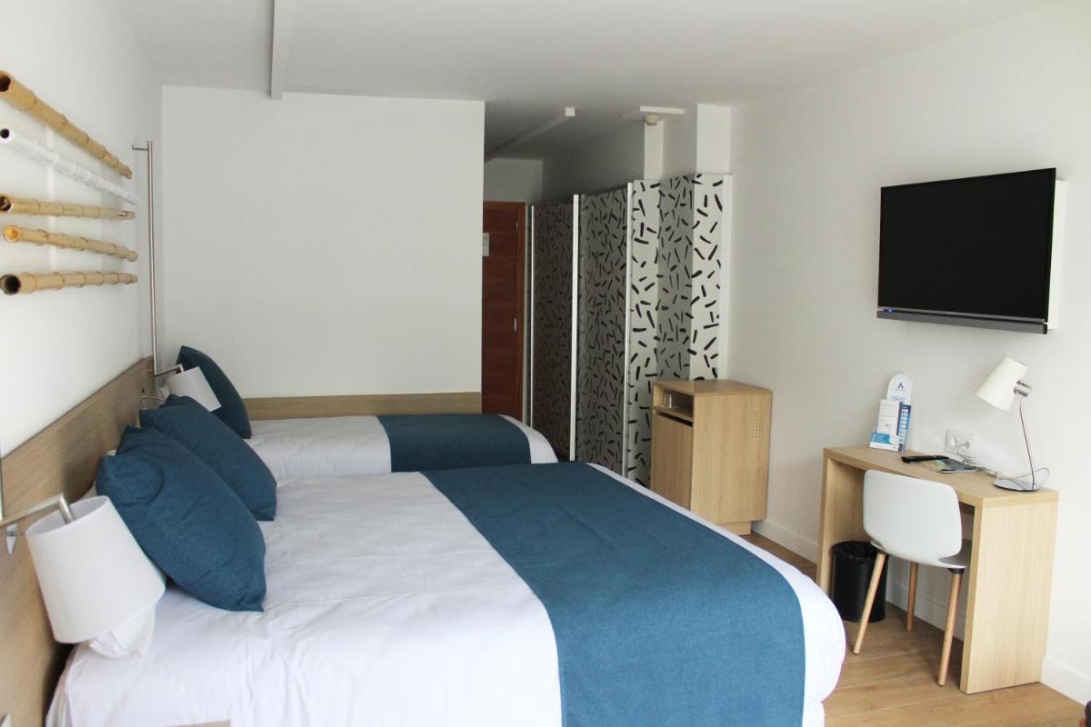 Cama o camas de una habitación en AQUA Hotel Onabrava & Spa 4*Sup