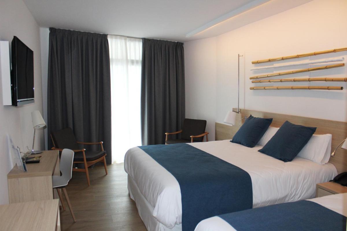 Cama o camas de una habitación en AQUA Hotel Onabrava & Spa 4*Sup