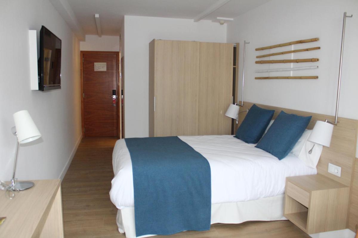Cama o camas de una habitación en AQUA Hotel Onabrava & Spa 4*Sup