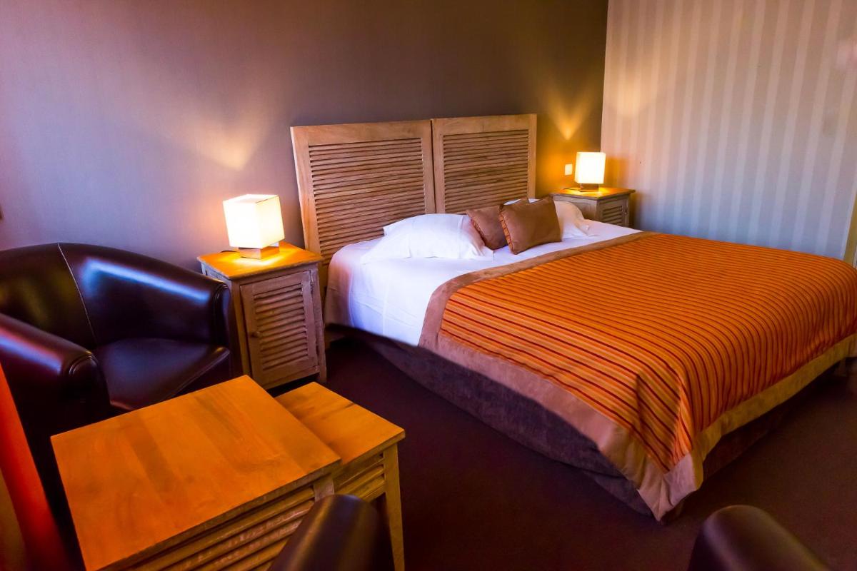 Un ou plusieurs lits dans un hébergement de l'établissement Almoria Hôtel & SPA