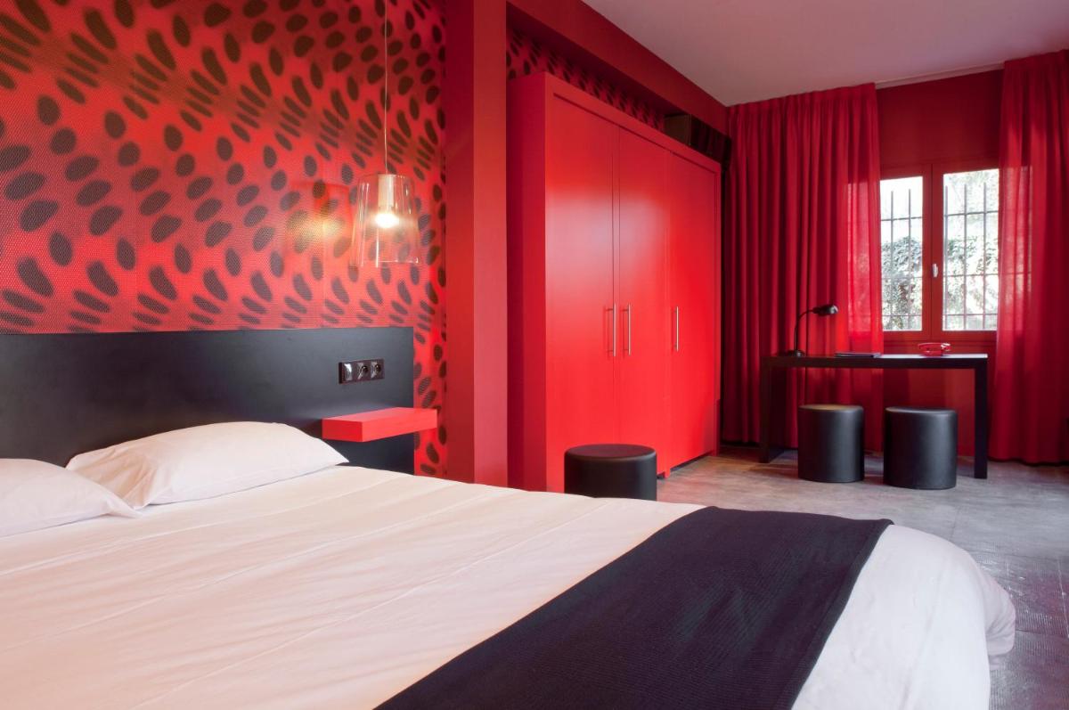 Un ou plusieurs lits dans un hébergement de l'établissement Hôtel Montmorency & Spa