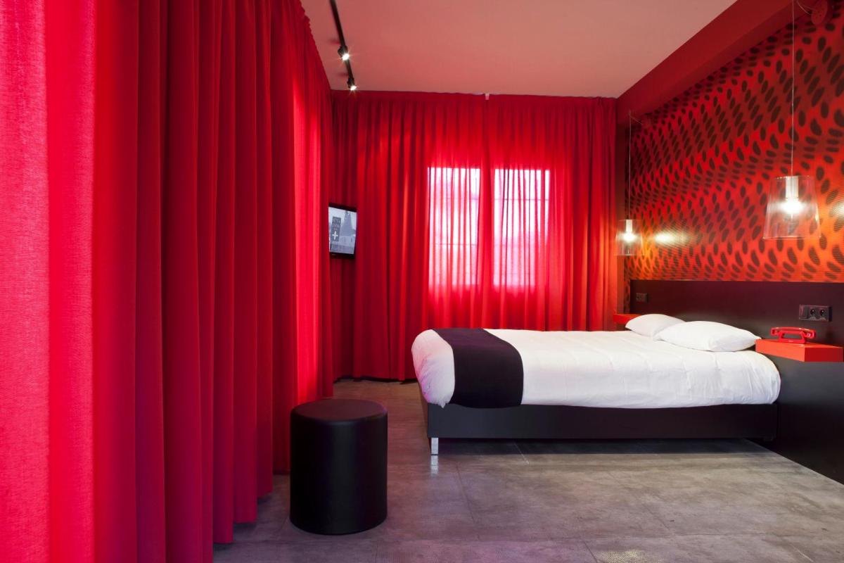 Un ou plusieurs lits dans un hébergement de l'établissement Hôtel Montmorency & Spa
