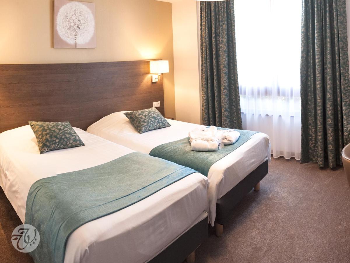 Un ou plusieurs lits dans un hébergement de l'établissement Hotel Restaurant & Spa Verte Vallée