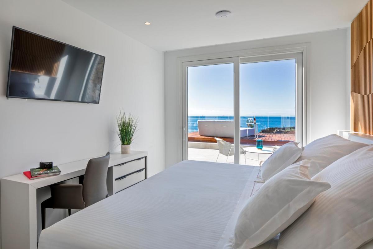 Cama o camas de una habitación en Royal Hideaway Corales Suites