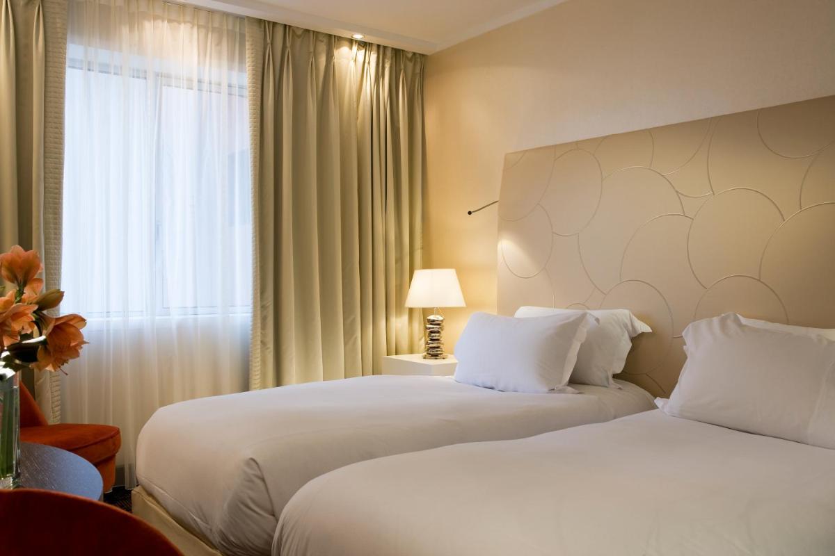 Un ou plusieurs lits dans un hébergement de l'établissement Sofitel Marseille Vieux-Port