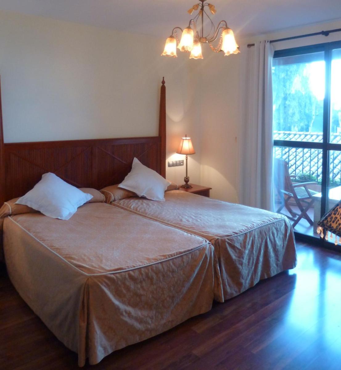 Cama o camas de una habitación en Hotel Sierra de Cazorla & SPA 3*
